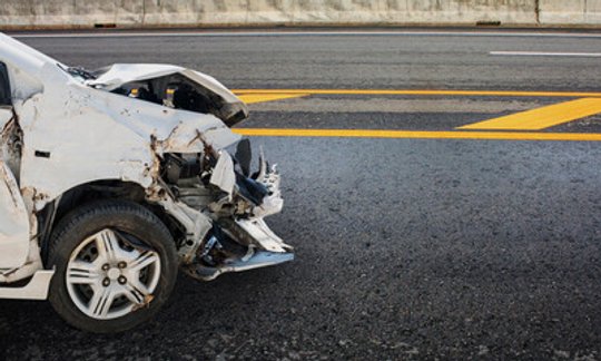 Car crash damaged from a wreck on a Texas highway road