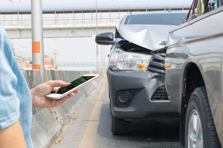 Car crash from car accident on the road in a city car pickup wait
